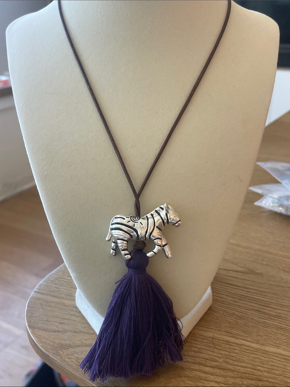 Zara Brown Cord Necklace with Silver Zebra Pendant and Purple Tassel